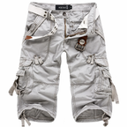 Light gray cargo shorts with multiple pockets on a white background