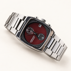 Claret Red Langford square chronograph watch with stainless steel bracelet on a warm cream background