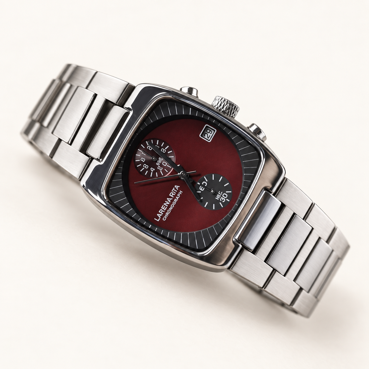 Claret Red Langford square chronograph watch with stainless steel bracelet on a warm cream background